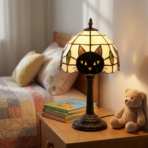 Black cat shaped table lamp glowing on a child's bedroom nightstand