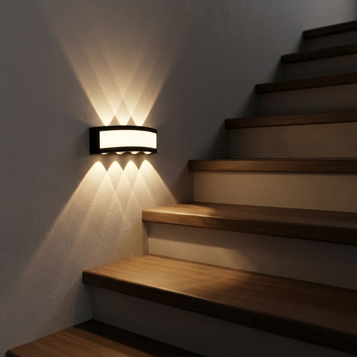 Compact LED effect wall light casting a warm wash across staircase treads